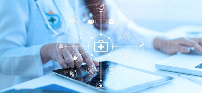 Medicine doctor or medical students with stethoscope using digital tablet laptop,Health Check with digital system support for patient with medical icon at hospital, Medical network technology concept.
